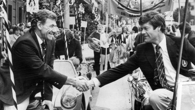 Collingwood coach Tom Hafey shakes hands with his Carlton counterpart David Parkin during the 1981 grand final parade.