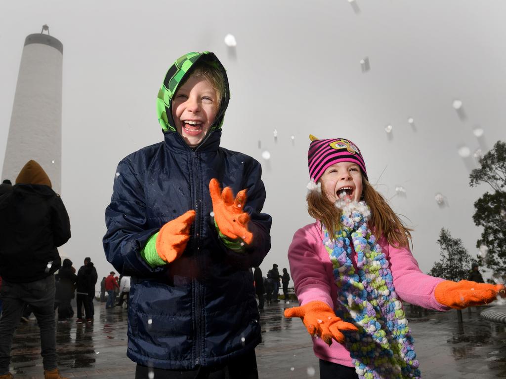 Sisters Maya and Tabitha Johnswood wait for the snow at Mt Lofty. Pic: Tricia Watkinson