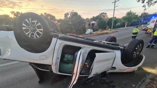 A driver survived after his car flipped at Baulkham Hills after he spilt coffee.