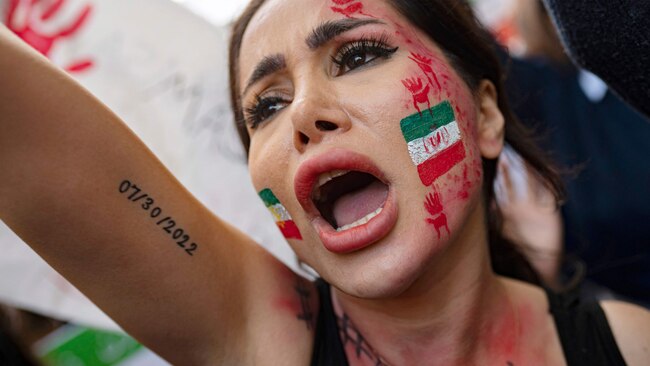 A woman protesting at the Iranian consulate in Istanbul following the death of Mahsi Amini