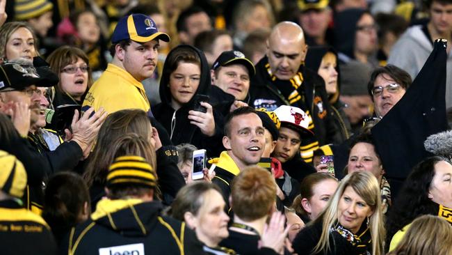 AFL Round 19: Richmond v GWS at MCG.Jake King has a beer?? with the cheers squad during the third quarter... Picture: Tim Carrafa