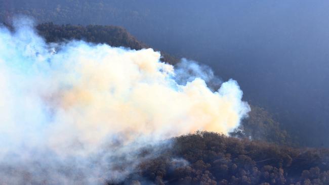 Aerial pictures over Binna Burra during the fire where visibility made it impossible to see the lodge. Picture: Adam Heads