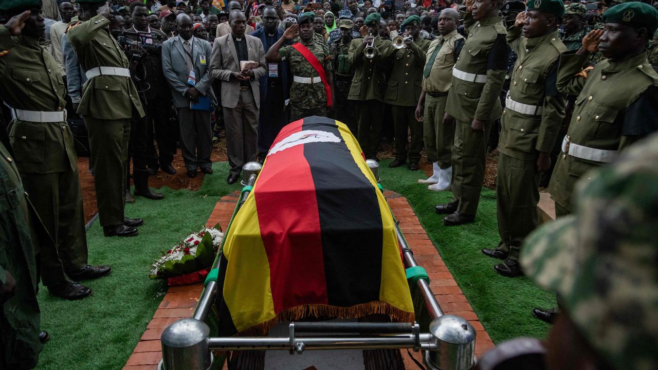 Soldiers stand near the coffin of late Olympian Rebecca Cheptegei. Photo by BADRU KATUMBA / AFP)