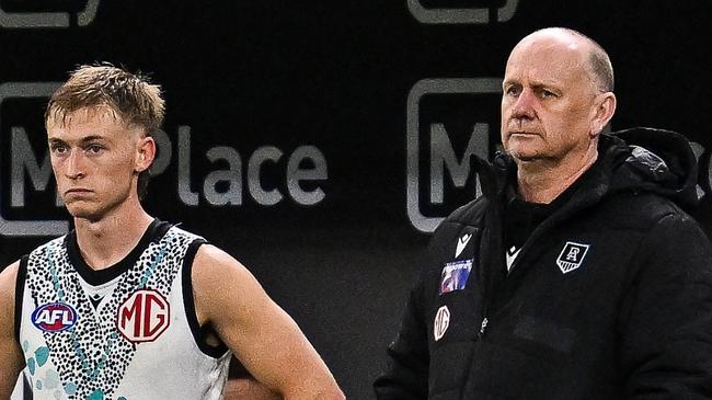 PERTH, AUSTRALIA - MAY 24: Ken Hinkley, Senior Coach of the Power coaches from the bench during the 2025 AFL Round 11 match between Walyalup (Fremantle Dockers) and Yartapuulti (Port Adelaide Power) at Optus Stadium on May 24, 2025 in Perth, Australia. (Photo by Daniel Carson/AFL Photos via Getty Images)