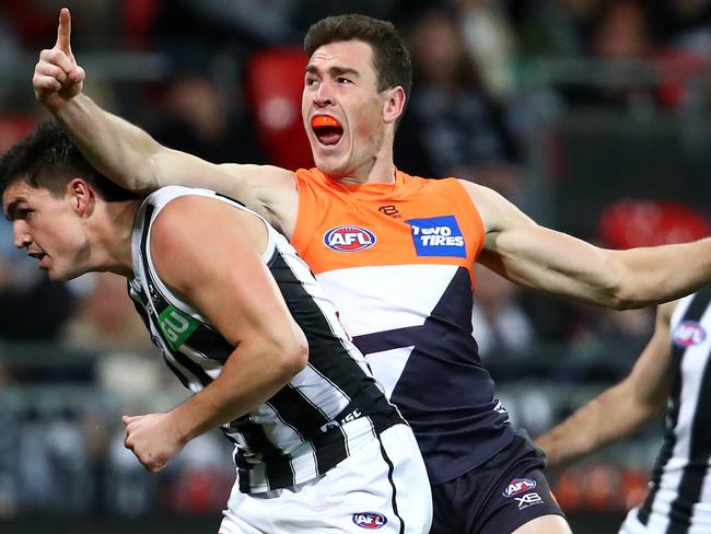 SYDNEY, AUSTRALIA - JULY 20: Jeremy Cameron of the Giants celebrates kicking a goal over Scott Pendlebury of the Magpies during the Greater Western Sydney Giants and the Collingwood Magpies at GIANTS Stadium on July 20, 2019 in Sydney, Australia. (Photo by Cameron Spencer/Getty Images)