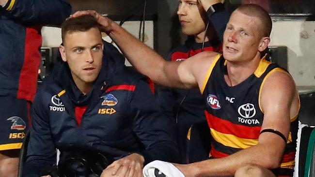 Brodie Smith of the Crows and an emotional Sam Jacobs embrace each other as the final siren sounds.