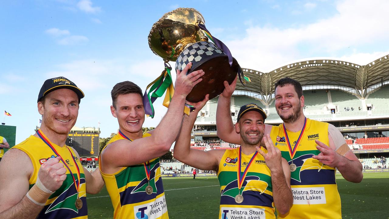 Patrick Giuffreda of the Eagles, with the three other players who have won three premierships - - Luke Thompson, Jimmy Toumpas and Jarrad Redden. Picture: Sarah Reed