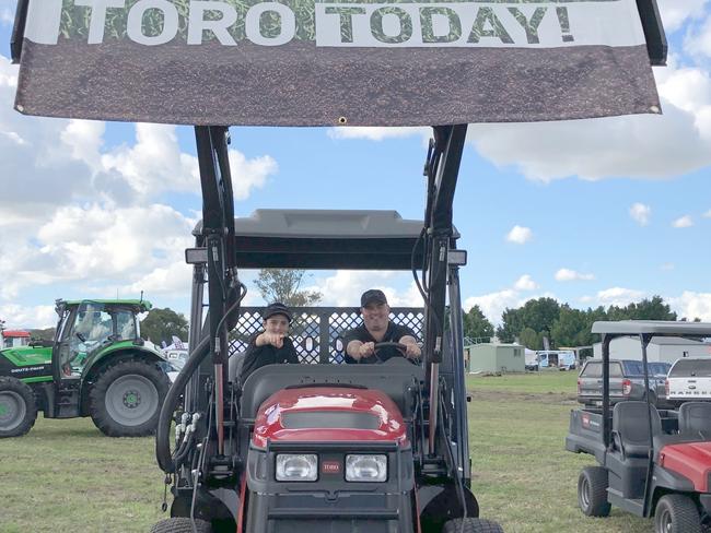 MEN ON A MISSION: Copper Massey, 10, directs dad Simon on where to drive the Toro Outcross,achine which will set back those looking after golf course or stadium surfaces around $140,000. Photo: Alison Paterson