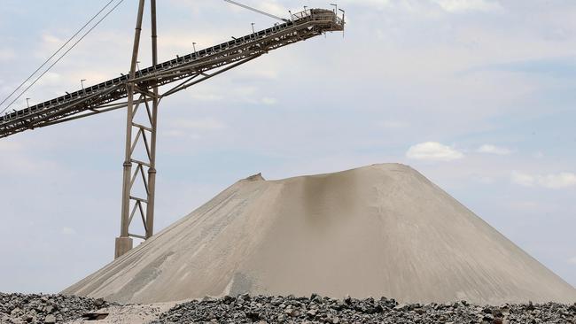 Spodumene ore stockpile seen at an operating mine in WA where there is growing corporate activity as global demand for critical minerals increases. Picture: Colin Murty The Australian