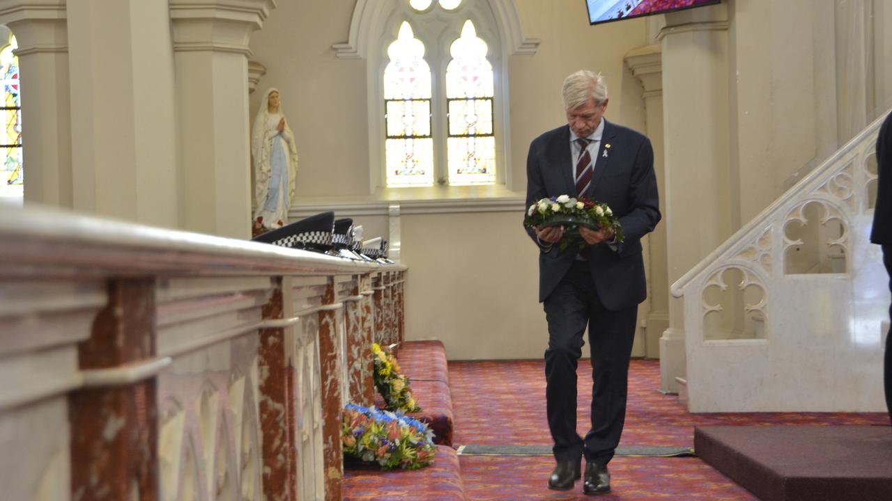 Lockyer MP Jim McDonald lays a floral tribute at the National Police Remembrance Day service in St Patrick's Cathedral, Toowoomba, September 27, 2024.