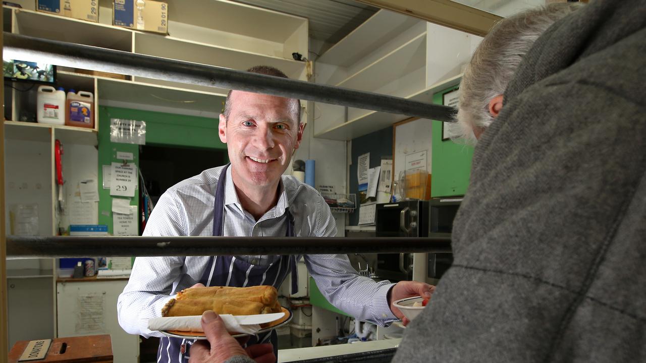 Give Where You Live CEO Bill Mithen at The Outpost dishing out some food. picture: Glenn Ferguson