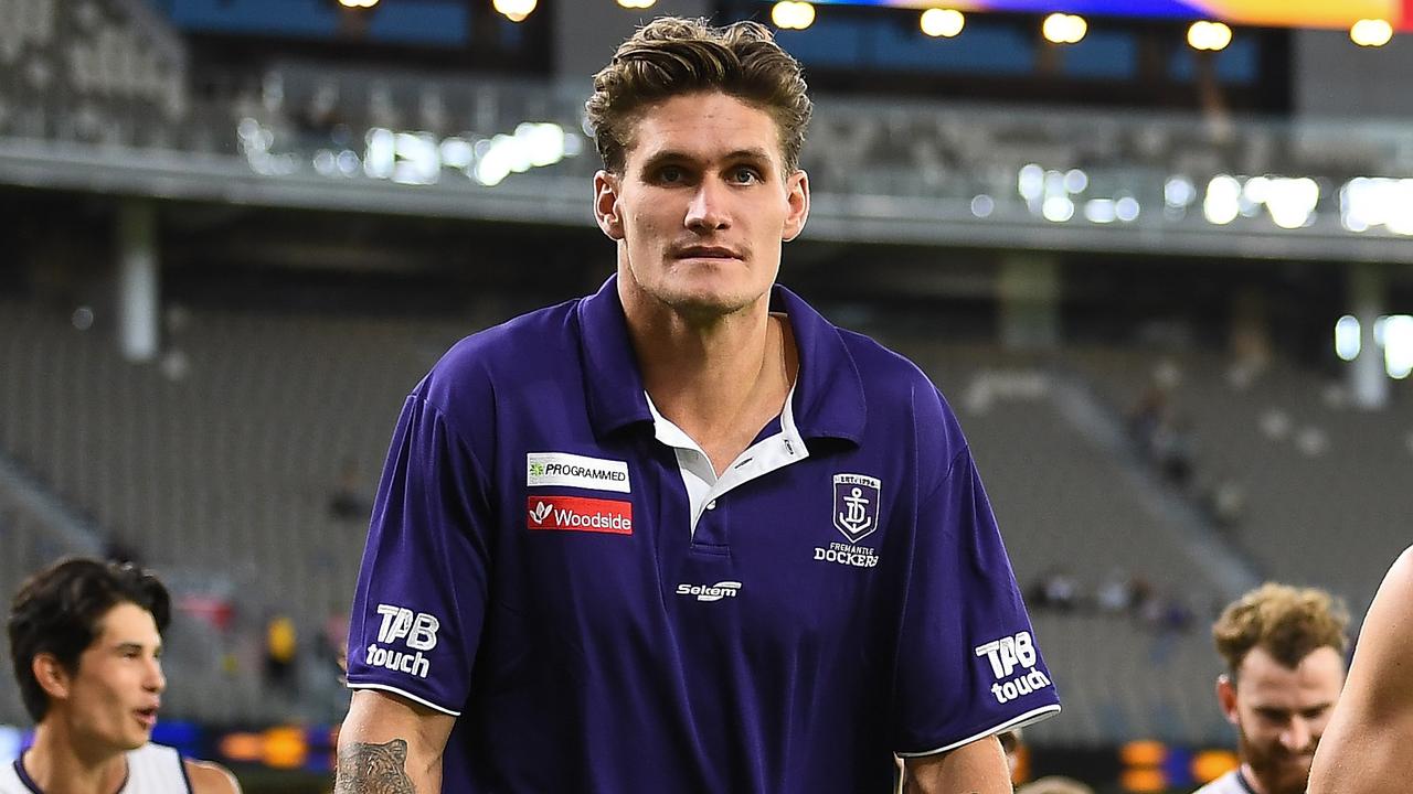 PERTH, AUSTRALIA - MARCH 07: Rory Lobb of the Dockers limps off the field after the game during the 2021 AAMI Community Series match between the West Coast Eagles and the Fremantle Dockers at Optus Stadium on March 7, 2021 in Perth, Australia. (Photo by Daniel Carson/AFL Photos via Getty Images)