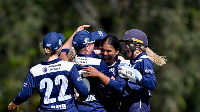 Cheeran takes her first wicket for Victoria. Picture: Bradley Kanaris/Getty Images.