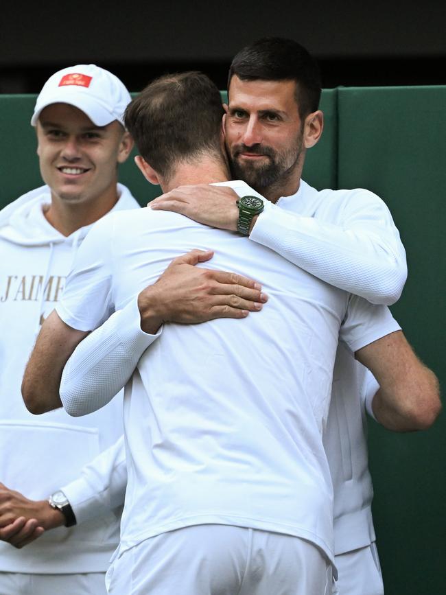 Andy Murray embraces with Novak Djokovic as part of his farewell presentation. Picture: Mike Hewitt/Getty Images