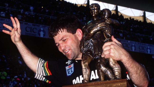 Hooker Royce Simmons celebrates with the trophy after Penrith won the 1991 grand final.