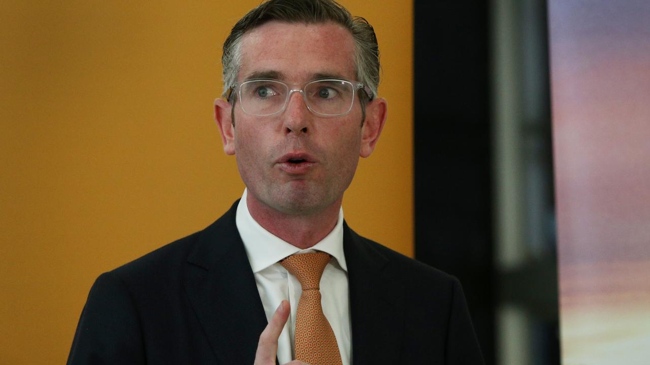 NSW Premier Dominic Perrottet addresses the media at Sydney's International Airport. Picture: Lisa Maree Williams/Getty Images