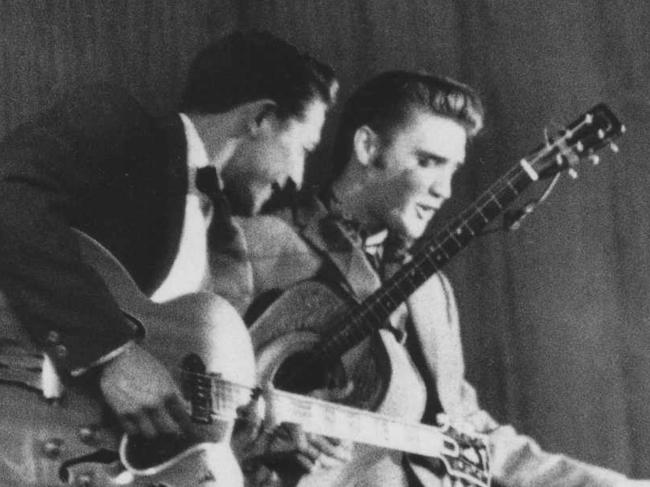 Guitarist Scotty Moore with singer Elvis Presley in 1956.