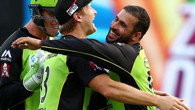 The Thunder's Fawad Ahmed celebrates taking the wicket of Moises Henriques.