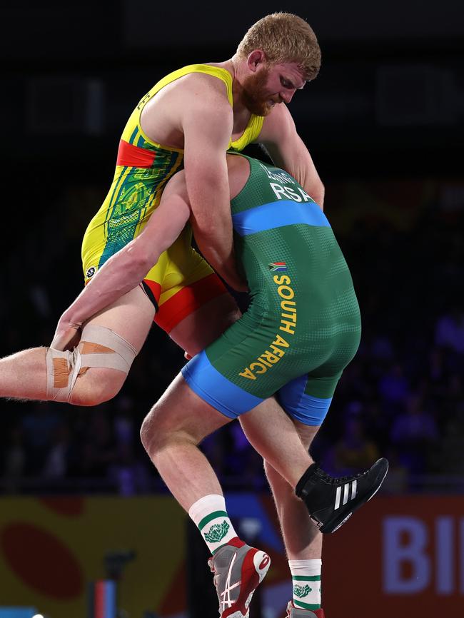 COVENTRY, ENGLAND – AUGUST 05: Jayden Lawrence (red) of Team Australia competes against Edward Lessing (blue) of Team South Africa.