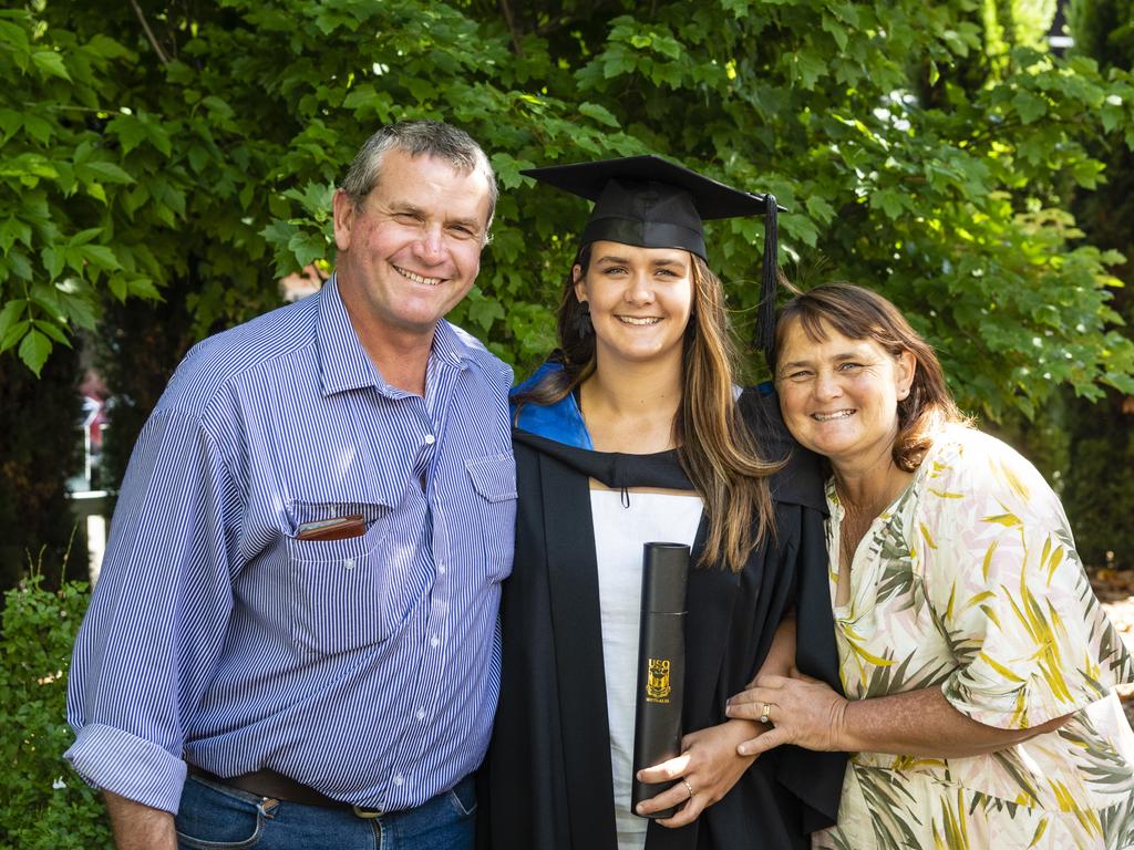 Bachelor of Sport and Exercise Science graduate Emily Hoffmann with parents Robert and Nacole Hoffmann at the UniSQ graduation ceremony at Empire Theatres, Wednesday, December 14, 2022.