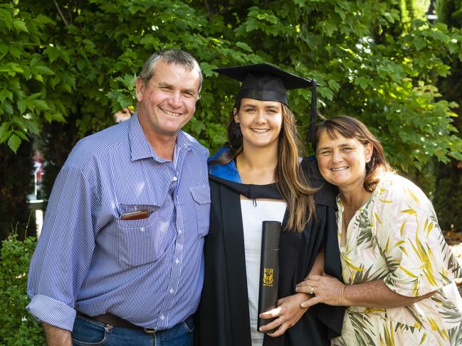 Bachelor of Sport and Exercise Science graduate Emily Hoffmann with parents Robert and Nacole Hoffmann at the UniSQ graduation ceremony at Empire Theatres, Wednesday, December 14, 2022.