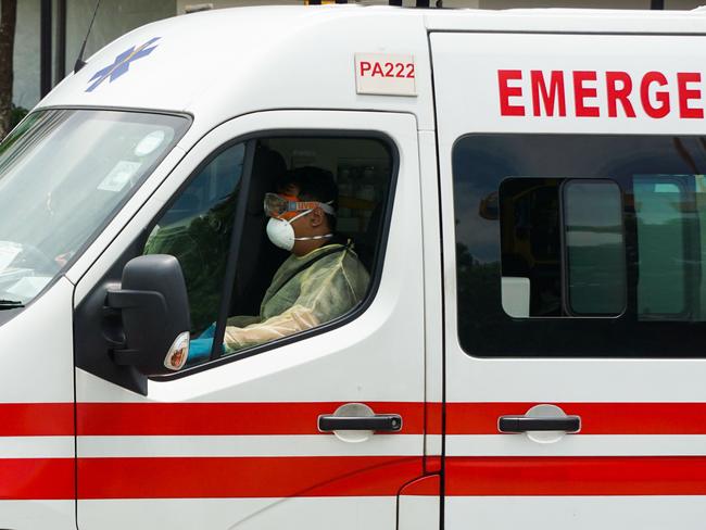 An ambulance leaves the National Centre for Infectious Diseases in Singapore. Picture; AFP.