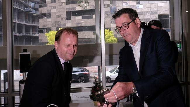 Victorian Premier Daniel Andrews shows his Covid vaccine certificate during his visit to the William Angliss College in Melbourne last week.