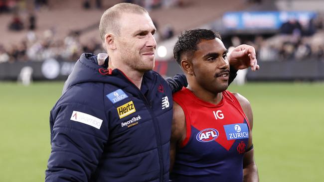 MELBOURNE, AUSTRALIA - AUGUST 23: Simon Goodwin, Senior Coach of the Demons embraces Kysaiah Pickett of the Demons after  the round 24 AFL match between Melbourne Demons and Collingwood Magpies at Melbourne Cricket Ground, on August 23, 2024, in Melbourne, Australia. (Photo by Darrian Traynor/Getty Images)