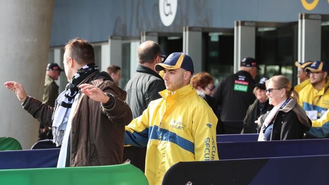 Security checking patrons at an MCG footy match. Picture: Alex Coppel.