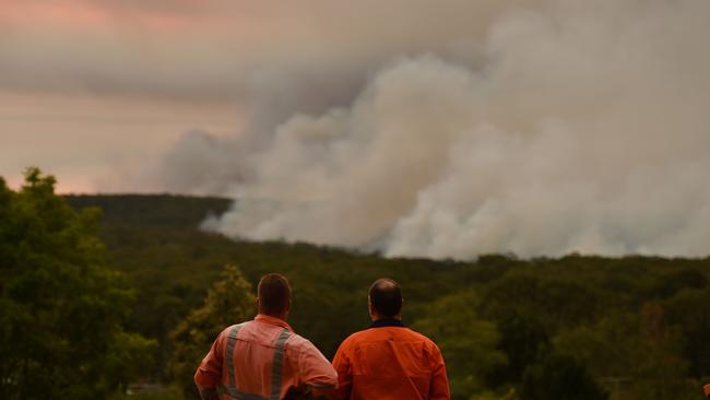 Residents watch a large bushfire as seen from Bargo, 150km southwest of Sydney, on December 19, 2019. Picture: AFP