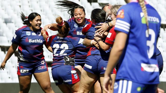 Campbelltown Collegians players celebrate their win at full time. Picture: John Appleyard