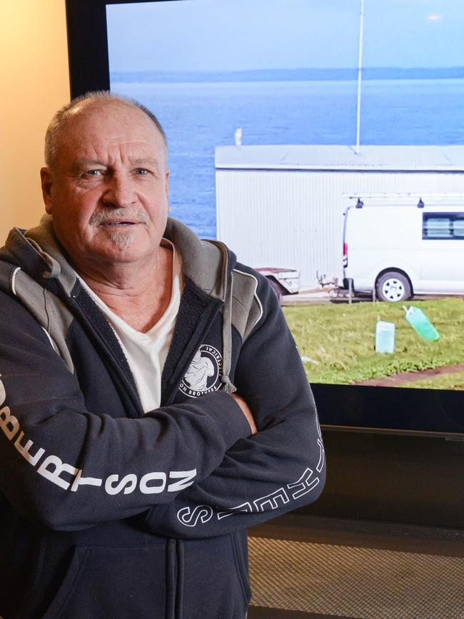 Barry Robertson with a picture of his shack. Picture: Brenton Edwards