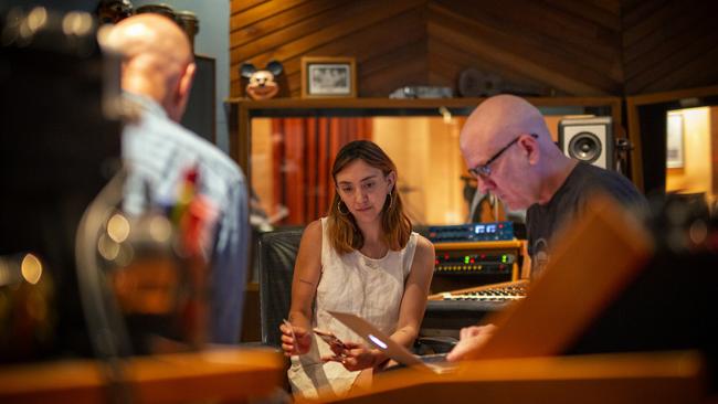 Alice Skye, in the recording studio with Peter Garrett, left, and producer Warne Livesey. will also join Midnight Oil on tour for Makarrata Live. Picture: Robert Hambling