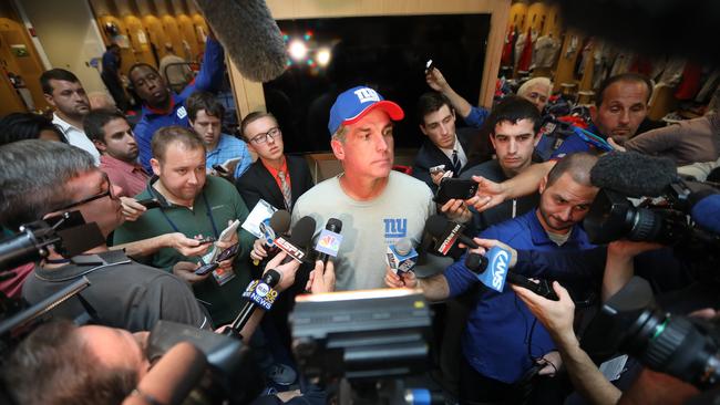 New York Giants special teams co-ordinator Tom Quinn listens to questions during a news conference.