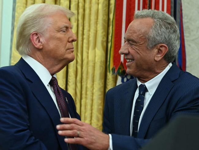 The new US Secretary of Health and Human Services Robert F. Kennedy Jr., shakes hands with US President Donald Trump after a swearing in ceremony in the Oval Office. Picture: AFP