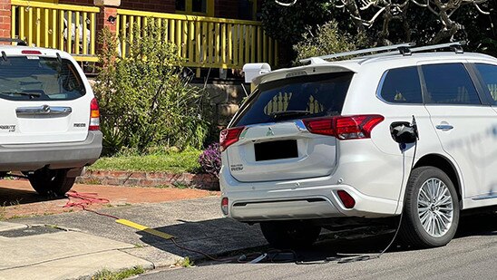 An electric car was parked out on the Manly street, with an extremely long power cord snaking from the property onto the road. Picture: 2GB