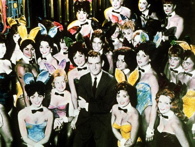 Playboy magazine founder and president Hugh Hefner with some of his bunnies at the Playboy Club, from the TV show 'America in The Fifties'.