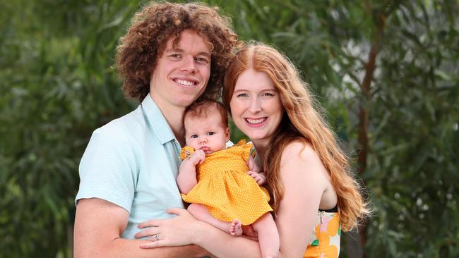 Hester Brown with husband and North Melbourne footballer Ben and baby Aila. Picture: Rebecca Michael