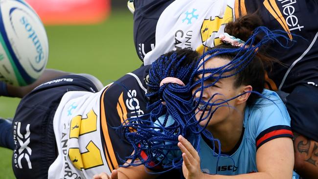 CANBERRA, AUSTRALIA - APRIL 01: Maya Stewart of the Waratahs  is tackled during the Super W match between ACT Brumbies Women and NSW Waratahs Women at GIO Stadium, on April 01, 2023, in Canberra, Australia. (Photo by Tracey Nearmy/Getty Images)