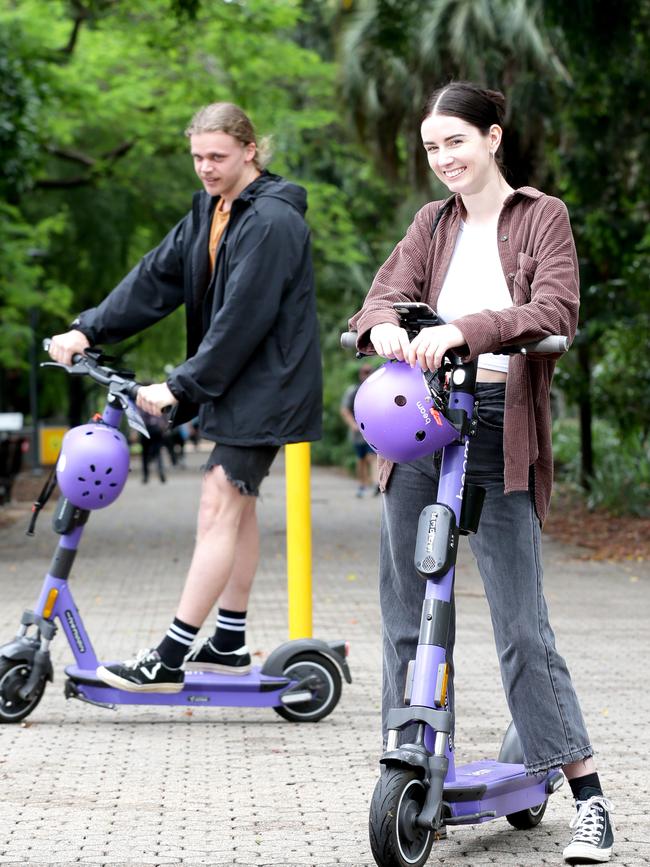 Jacob Ross and Georgia Ross from Kelvin Grove ride Beam e-scooters in the Adelaide Botanic Gardens. Picture: Steve Pohlner