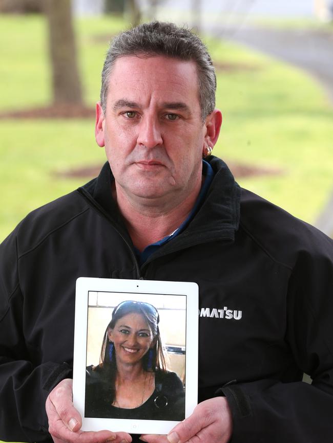 Anthony Santuccione holding a photo of Ms Galea. Picture: Mike Dugdale