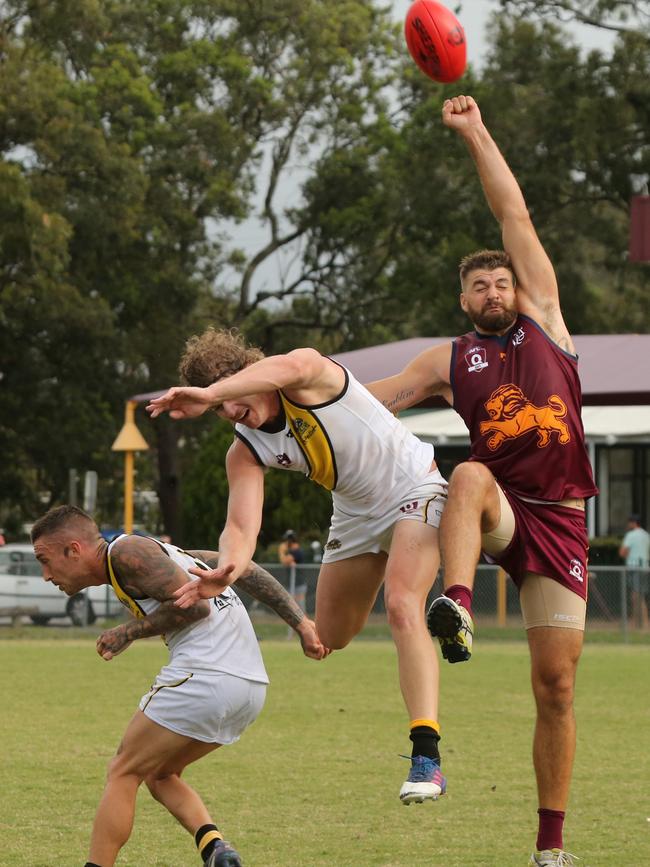 QAFL Australian Rules grand final replay between premiers Palm Beach Currumbin and Labrador Tigers. PBC player No 32 Jackson Emblem Labrador Player No17 Jake Goldsmith Picture Mike Batterham