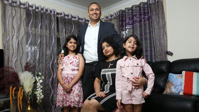 Mukesh Kumar, his wife Shilpi and daughters Misha, 9 and Prisha, 6, pictured in their home at Toongabbie in Sydney’s west. Picture: Britta Campion