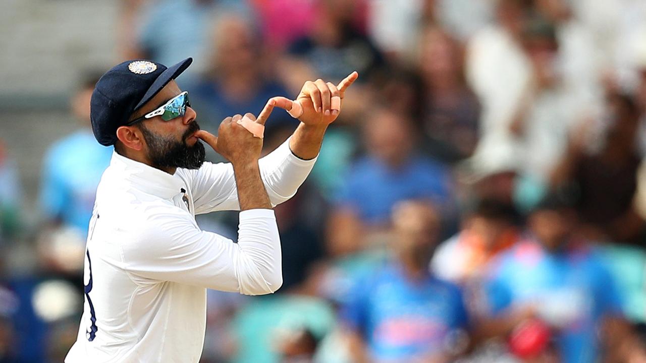 Virat Kohli of India looks like he's playing a trumpet as he celebrates Ollie Pope’s wicket during day five of the fourth Test against England. Photo: Getty Images