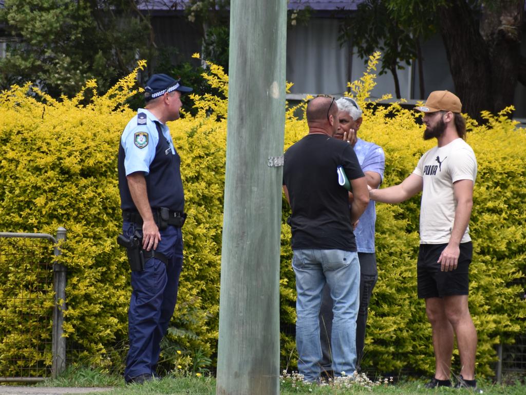 Police speak with residents near the scene where police arrested a man in Grafton on Sunday, 20th September, 2020.