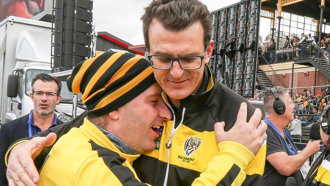 Brendon Gale gets a hug from a thankful fan at the club’s official Grand Final Family Day at Punt Road Oval. Picture: Tim Carrafa