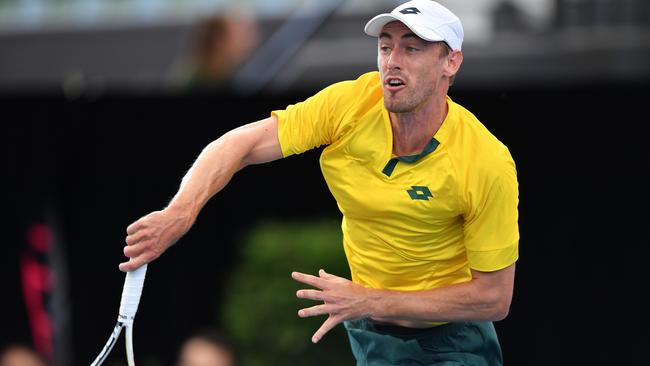 John Millman serves during the Davis Cup Qualifier singles match. Picture: Mark Brake/Getty Images.