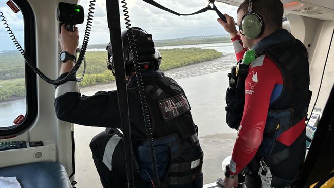 Rescue crews returned to the scene where a man was saved after becoming stuck in mud in Moreton Bay. Picture: QAS