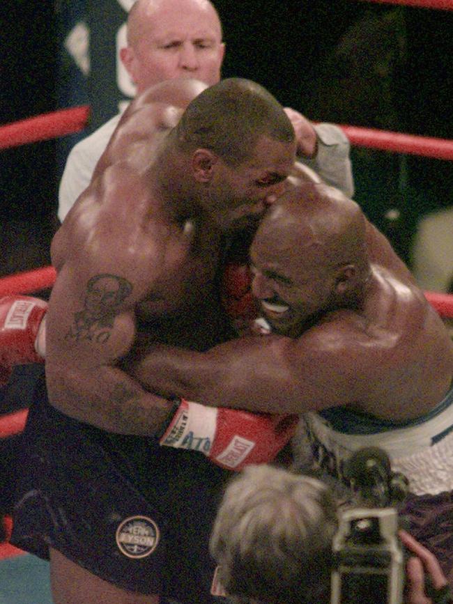 Tyson takes a bite out of Holyfield. Picture: AP/Jack Smith