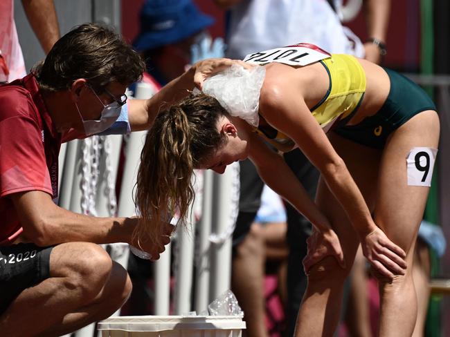 Australia's Georgia Winkcup tries to cool down after her 3000m steeplechase heat. Picture: AFP